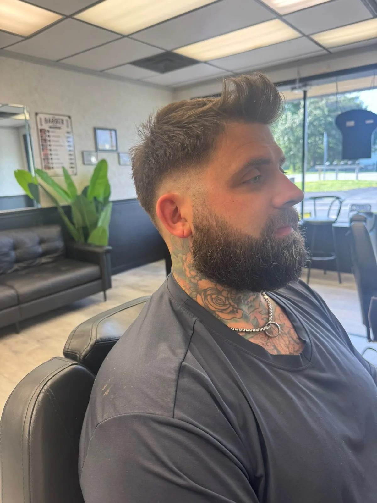 Side view of a clean hair cut with sideburn details