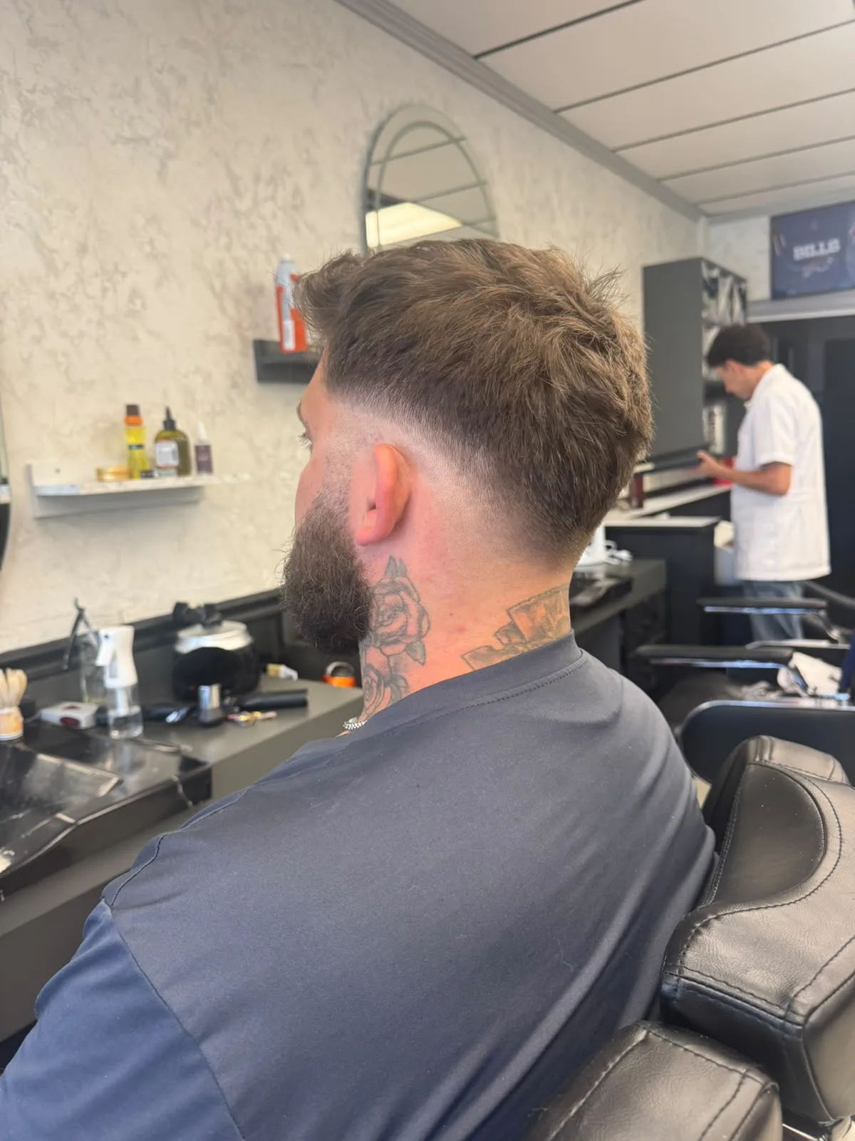 Back view of a detailed taper hair cut design
